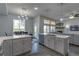 Bright, open kitchen with a center island, stainless steel appliances, and a dining area at 12254 Hazel Spruce Ct, Parker, CO 80134