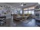 Spacious living room with a large sectional sofa, fireplace, and hardwood floors at 12254 Hazel Spruce Ct, Parker, CO 80134