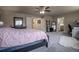 Bright main bedroom with a seating area and entrance into the en-suite bathroom at 12254 Hazel Spruce Ct, Parker, CO 80134
