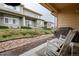 Inviting covered patio with comfortable rocking chairs, perfect for relaxing outdoors at 12254 Hazel Spruce Ct, Parker, CO 80134