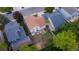 Aerial view of a well-maintained backyard, featuring a patio area, mature trees, and privacy fencing at 13069 Jackson Dr, Thornton, CO 80241