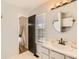 Bathroom features a single sink vanity and open door to bedroom at 13069 Jackson Dr, Thornton, CO 80241