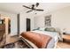 Spacious bedroom with modern decor, ceiling fan, and ensuite bathroom at 13069 Jackson Dr, Thornton, CO 80241