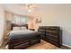 Bedroom with wooden bed frame, ceiling fan, and matching dresser at 13069 Jackson Dr, Thornton, CO 80241