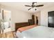Bedroom with modern dressers, ceiling fan, and ensuite bathroom at 13069 Jackson Dr, Thornton, CO 80241