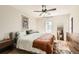 Bright bedroom with ceiling fan, rug, and large window for natural light at 13069 Jackson Dr, Thornton, CO 80241