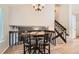 Elevated dining area overlooking the lower level, featuring hardwood floors and modern furnishings at 13069 Jackson Dr, Thornton, CO 80241