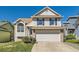 Charming two-story home with brick accents, blue shutters, and a well-maintained front yard at 13069 Jackson Dr, Thornton, CO 80241