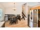 Kitchen and dining area with stainless steel fridge and staircase in the background at 13069 Jackson Dr, Thornton, CO 80241