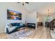 Cozy living room with hardwood floors, comfortable seating, and a dining area at 13069 Jackson Dr, Thornton, CO 80241
