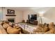 Comfortable living room featuring a fireplace, plush sectional sofa, and a modern entertainment setup at 13069 Jackson Dr, Thornton, CO 80241