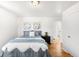 A comfortable bedroom with stylish art, a nightstand, and an ensuite bathroom at 3740 W Exposition Ave, Denver, CO 80219