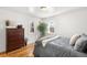 Bright bedroom features hardwood floors, windows, and stylish decor at 3740 W Exposition Ave, Denver, CO 80219