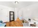 Versatile home office featuring hardwood floors, neutral tones, and ample workspace at 3740 W Exposition Ave, Denver, CO 80219