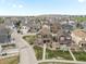 Aerial view of a home in a suburban neighborhood with green spaces at 1344 S Coolidge Cir, Aurora, CO 80018