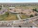 A high-angle shot features a school building and its surrounding neighborhood at 1344 S Coolidge Cir, Aurora, CO 80018