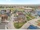 Scenic aerial of the neighborhood with mountain views in the distance at 1344 S Coolidge Cir, Aurora, CO 80018