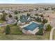 Community clubhouse and pool with manicured landscaping at 1344 S Coolidge Cir, Aurora, CO 80018