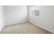 Bright bedroom with neutral carpet, large window, and ample natural light at 1344 S Coolidge Cir, Aurora, CO 80018