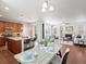 Open floor plan with dining area and kitchen island at 1344 S Coolidge Cir, Aurora, CO 80018