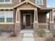 Close-up of the front entrance with stone pillars and house number at 1344 S Coolidge Cir, Aurora, CO 80018