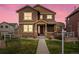 Charming two-story home with a welcoming front porch and beautiful stone accents at 1344 S Coolidge Cir, Aurora, CO 80018