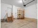 Large, empty garage with door to the house and room for storage at 1344 S Coolidge Cir, Aurora, CO 80018