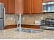 Kitchen with ample counter space and stainless steel appliances at 1344 S Coolidge Cir, Aurora, CO 80018