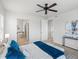 Stylish bedroom featuring modern lighting and a connected bathroom at 1344 S Coolidge Cir, Aurora, CO 80018