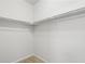 Spacious walk-in closet with double-hanging rods offers ample storage space and organization at 1344 S Coolidge Cir, Aurora, CO 80018