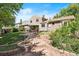 Enjoy this backyard with covered patio, stone walkway, and landscaped garden beds enhancing its appeal at 11530 Elm Ct, Thornton, CO 80233