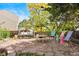 Stone patio with swing set and an arrangement of colorful outdoor chairs offering a delightful outdoor retreat at 11530 Elm Ct, Thornton, CO 80233