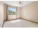 Bedroom featuring neutral walls, carpet, a window, and curtains, offering a clean and simple design at 11530 Elm Ct, Thornton, CO 80233