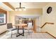Sunlit breakfast nook with tile flooring and direct view and access to the home's staircase at 11530 Elm Ct, Thornton, CO 80233