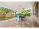 The covered patio features ceiling fans and colorful chairs, providing a comfortable space for outdoor gatherings at 11530 Elm Ct, Thornton, CO 80233