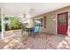 Charming covered patio with stone flooring, ceiling fans, and comfortable seating for relaxing outdoors at 11530 Elm Ct, Thornton, CO 80233