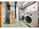 Laundry room with a washer, dryer, water heater, and furnace at 11530 Elm Ct, Thornton, CO 80233