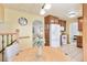 Bright living area with a table, a staircase, and access to the kitchen in an open concept home at 11530 Elm Ct, Thornton, CO 80233