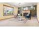 Bright living room with a fireplace, open shelving, and comfortable seating at 11530 Elm Ct, Thornton, CO 80233