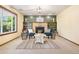 Inviting living room with a brick fireplace, built-in shelves, and neutral decor at 11530 Elm Ct, Thornton, CO 80233