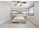 Cozy main bedroom with striped accent wall, lots of natural light, and neutral decor at 11530 Elm Ct, Thornton, CO 80233
