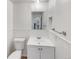 Bathroom featuring beadboard walls, a white vanity, and a silver framed mirror at 3061 W 92Nd Ave # 11B, Westminster, CO 80031