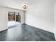 Dining room with dark tile floors and sliding glass doors to the backyard at 3061 W 92Nd Ave # 11B, Westminster, CO 80031