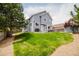 Large backyard with ample lawn space and a patio with furniture and grill at 15389 E 99Th Way, Commerce City, CO 80022