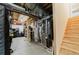 Unfinished basement with utilities, exposed ceiling, and wooden staircase at 15389 E 99Th Way, Commerce City, CO 80022