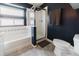 This bathroom features a bathtub with tile surround and a glass-enclosed shower at 15389 E 99Th Way, Commerce City, CO 80022