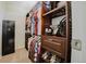 Walk-in closet with wood shelving and hanging rods for optimal storage and organization at 15389 E 99Th Way, Commerce City, CO 80022