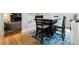 Cozy dining area featuring a modern table set on a blue rug, perfect for Gathering meals and entertaining guests at 15389 E 99Th Way, Commerce City, CO 80022