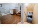 Bright entryway with hardwood floors, leading to stairs and a lower level at 15389 E 99Th Way, Commerce City, CO 80022