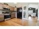 Modern kitchen with stainless steel appliances, stylish backsplash, and abundant counter space, perfect for cooking and entertaining at 15389 E 99Th Way, Commerce City, CO 80022
